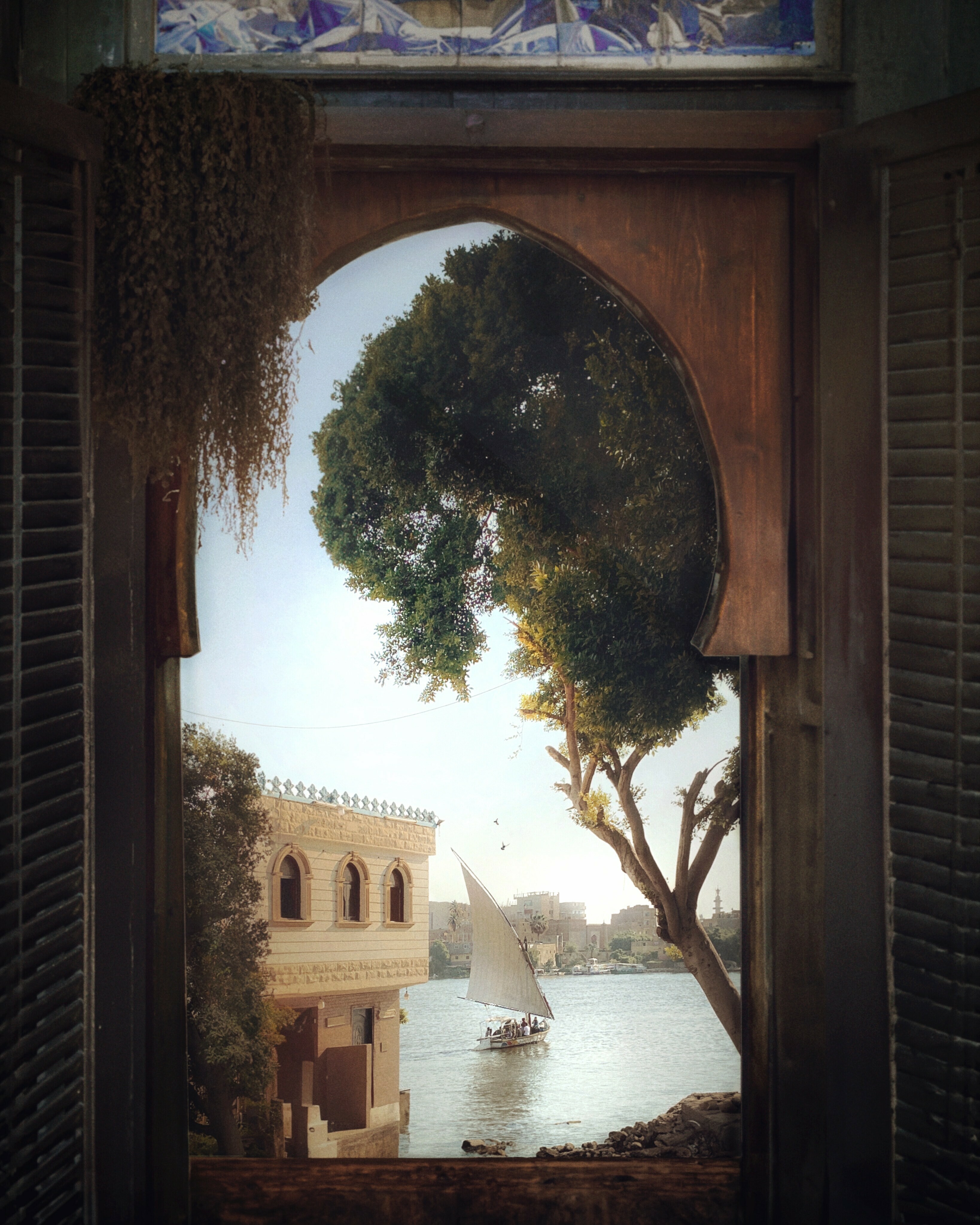 El Massry took this photo of a felucca sailing down the Nile in the south of Cairo on a morning in 2022. He digitally framed the image with a photo of a window in an old antique shop, and in his signature style, added a bird or two.